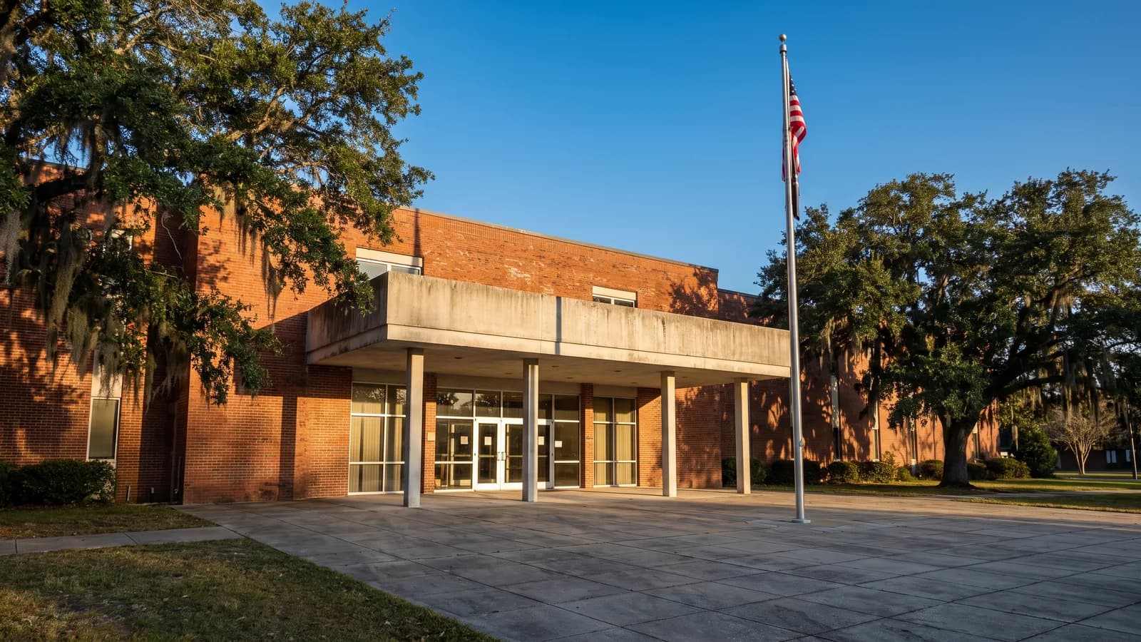 A county government administration building with a permits and inspections public entrance