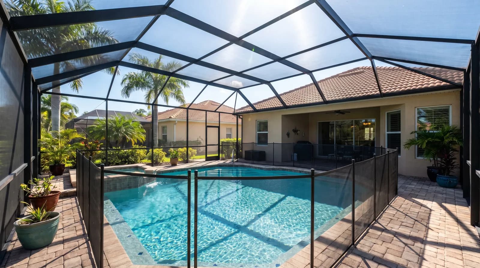 A screened residential swimming pool behind a Florida home